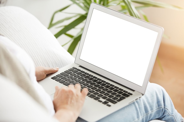 Cropped shot view of young smart mature female businesswomen working online via laptop