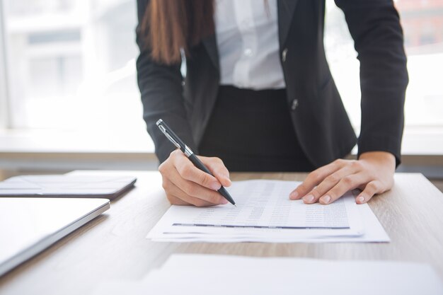 Free Photo cropped view of assistant working with document
