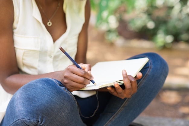 Cropped View of Black Woman Working in Park