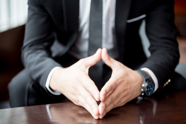 Cropped View of Businessman Holding Hands Together
