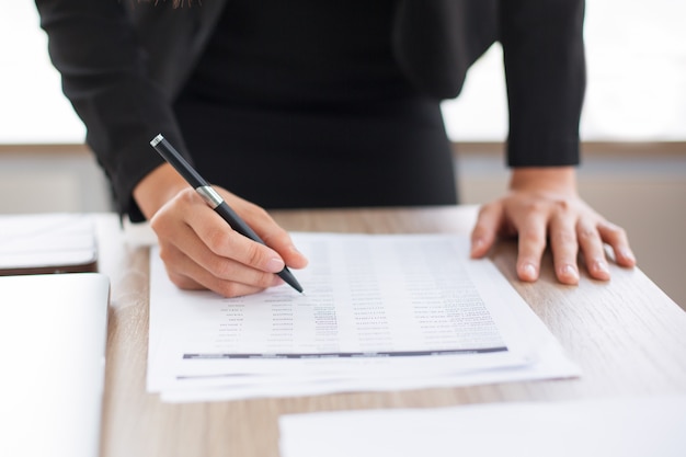 Cropped View of Businesswoman Looking Through List