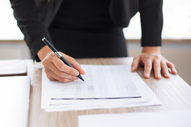 Cropped View of Businesswoman Looking Through List