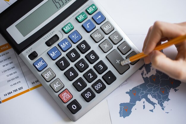 Cropped View of Man Hand Working With Calculator