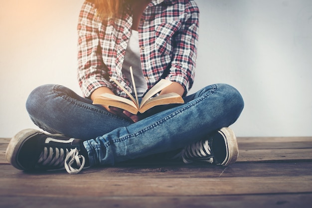 Cross-legged girl sitting in the floor