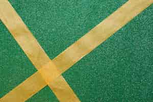 Free photo crossing ribbons on green background
