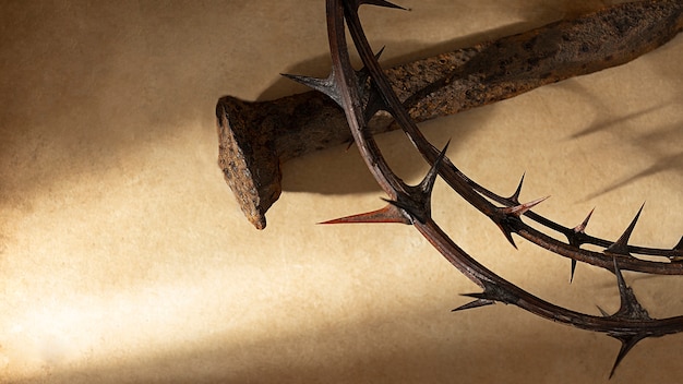 Free photo crown of thorns and nail still life