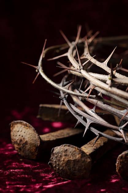 Free photo crown of thorns and rusty nails high angle