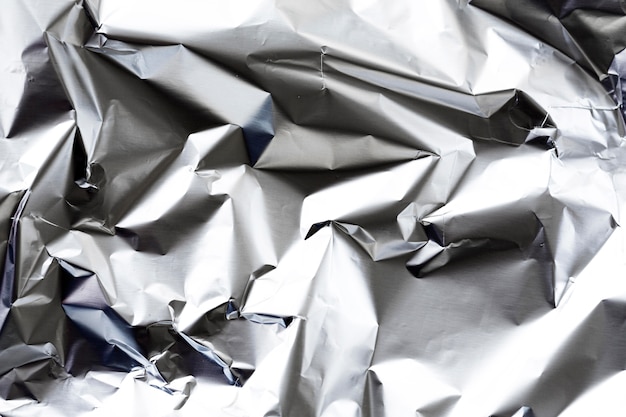 Free photo crumpled aluminium foil background