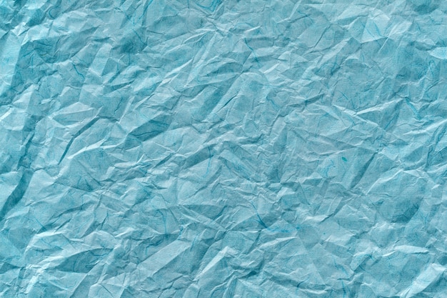 Crumpled blue paper