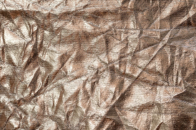 Crumpled up golden foil background