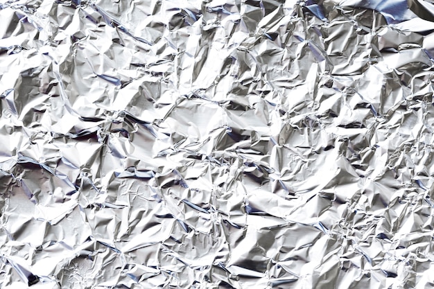 Crumpled white aluminium foil background