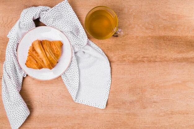 Crunchy croissant and tea copy space