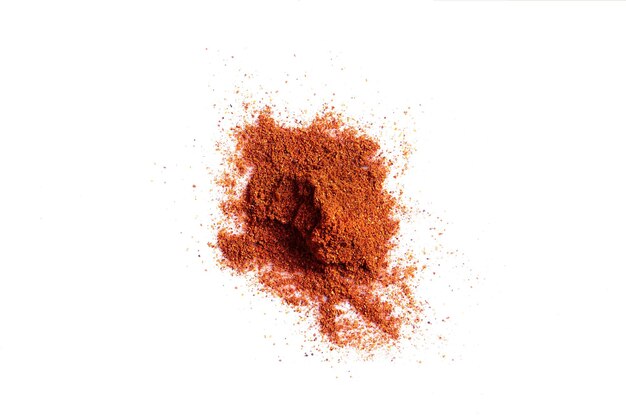 Crushed red pepper chilli pile from top on white background. Still life. Flat lay. Copy space. Spice