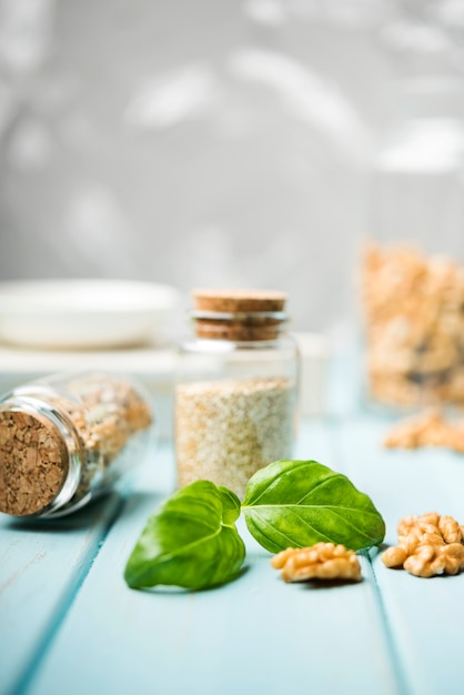 Crushed seeds in cute tiny glass jars front view