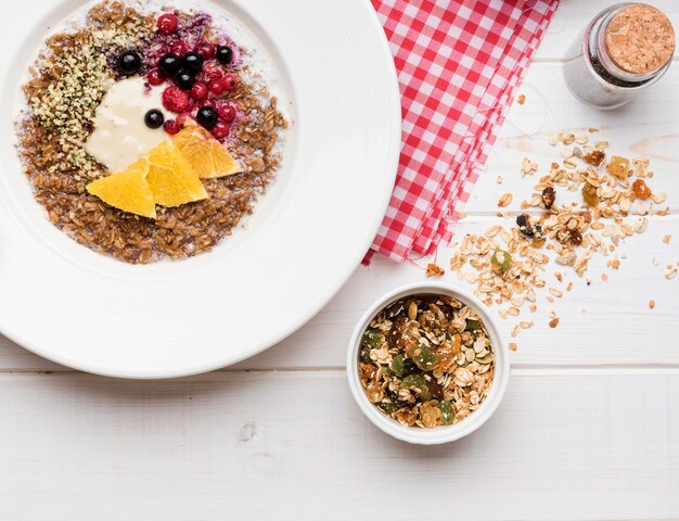 Crushed seeds with slices of orange and fruit cereals