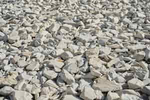 Free photo crushed and split stone closeup selective focus construction rubble background to describe construction or stone mining