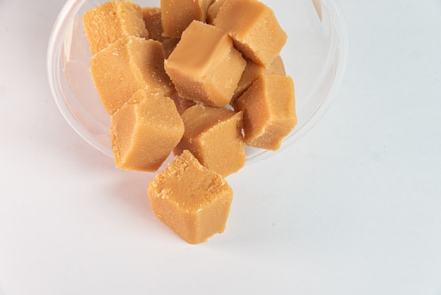 Cubes of dulce de leche on the white background