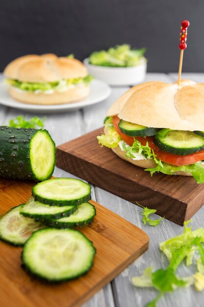 Cucumber slices and sandwich with salad