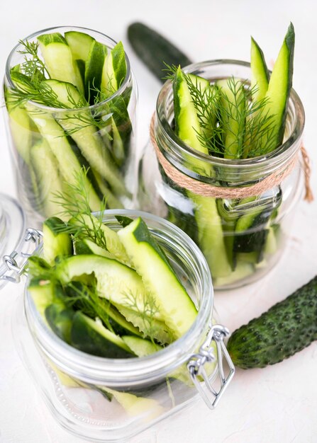 Cucumbers in jars high angle