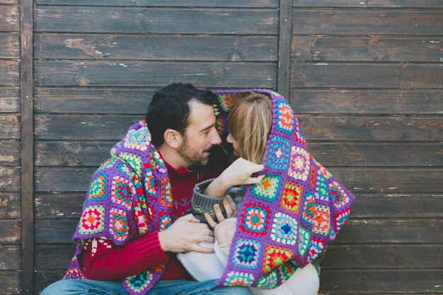 Cuddling couple in plaid