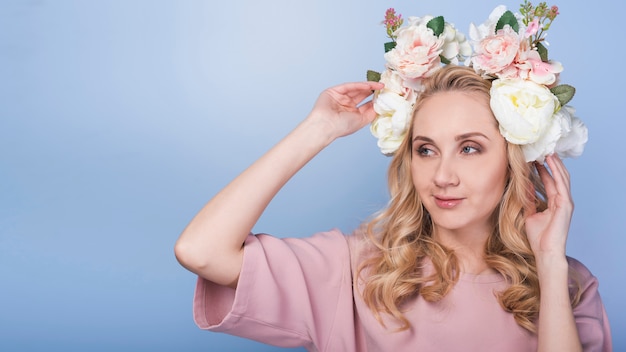 Cunning passionate lady with flowers on head