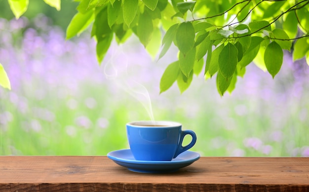 Cup of aromatic coffee outdoors