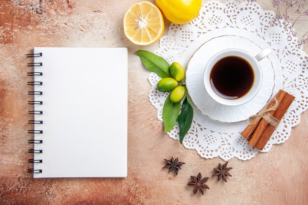 A cup of black tea on a decorated napkin