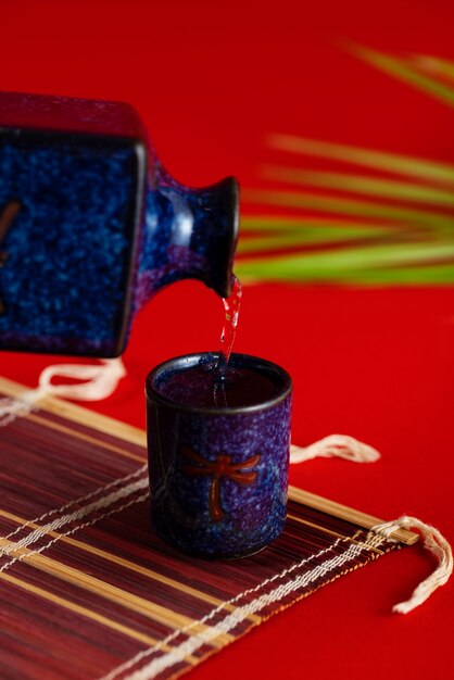 Cup and bottle with sake drink