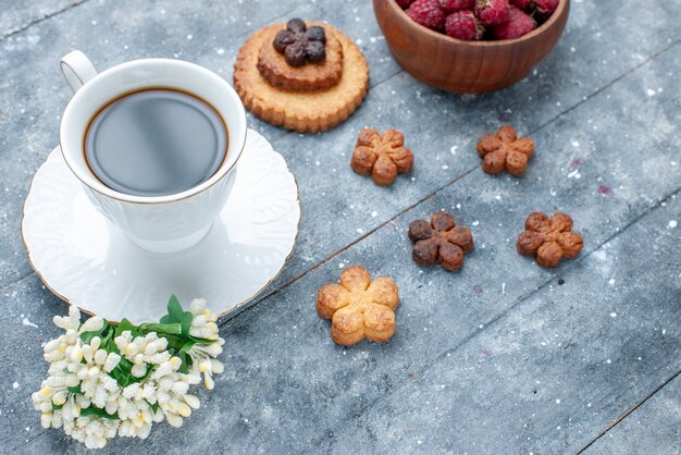 cup of coffee along with little cookies and berries on grey wooden, sweet bake pastry cookie biscuit