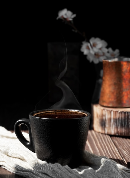 Cup of coffee of aromatic espresso on a wooden surface