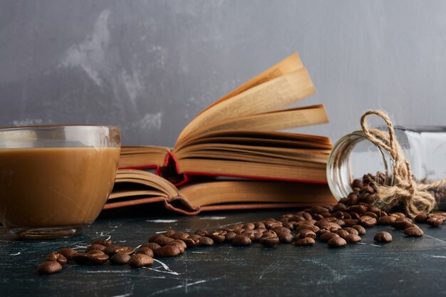 A cup of coffee on blue table.