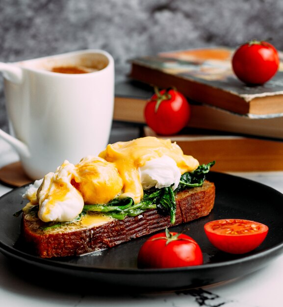 A cup of coffee and bread topped with cheese