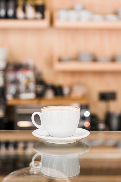 Cup of coffee on counter in caf� shop