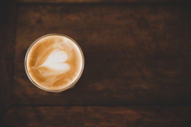 Cup of coffee latte on wood table in coffee shop cafe 