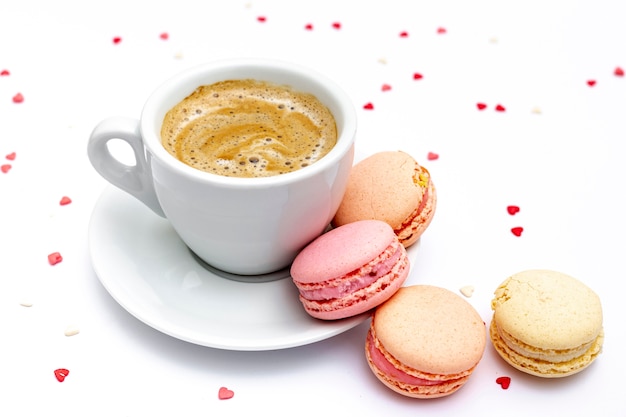 Cup of coffee and macarons for valentines day