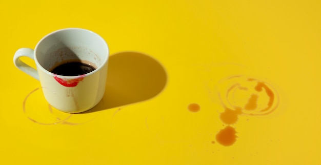 Cup of coffee stained with lipstick