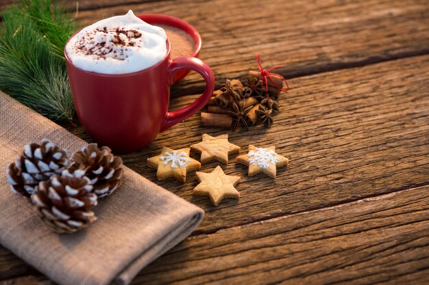 Cup of coffee with christmas cookies