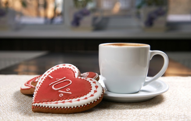 Free photo cup of coffee with cookies