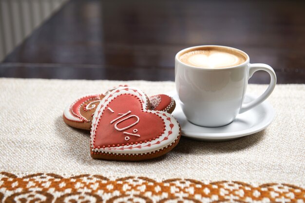 Free photo cup of coffee with cookies