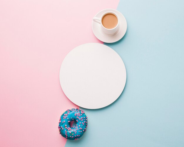 Cup of coffee with doughnut