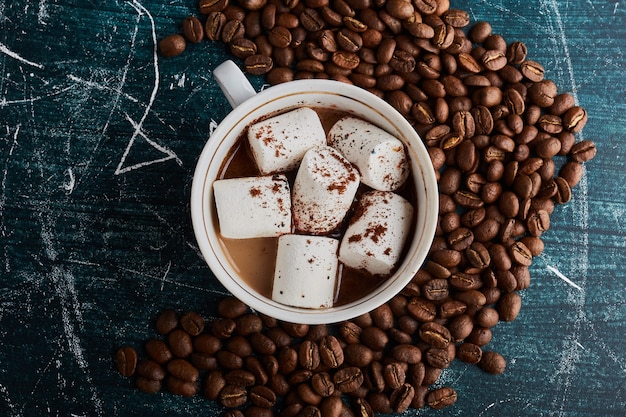 A cup of coffee with marshmallows. 