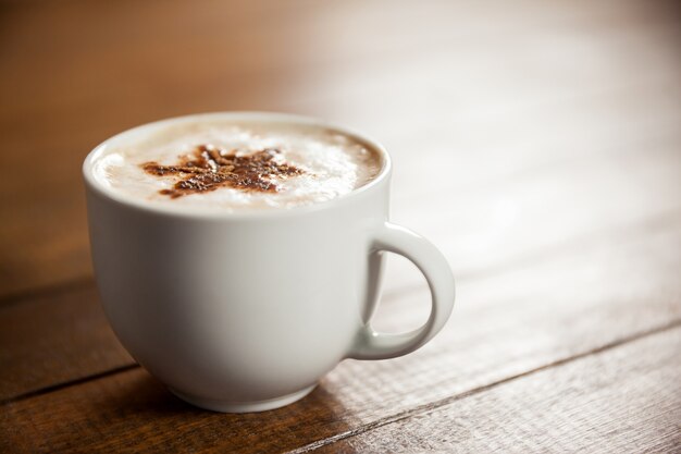 Cup of coffee with star latte art