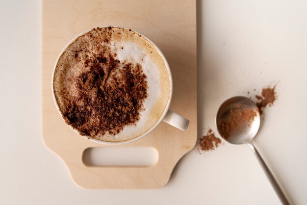 Cup of coffee on wooden board