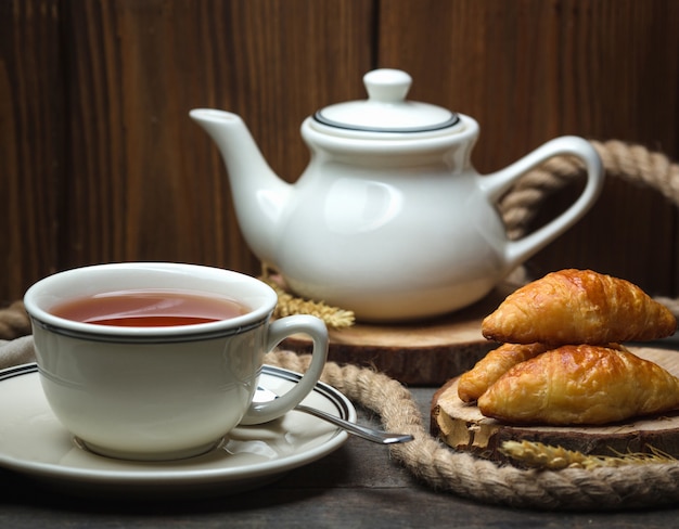 Cup of flavored tea with puff pastries