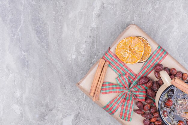 A cup of herbal tea with spices and fruits