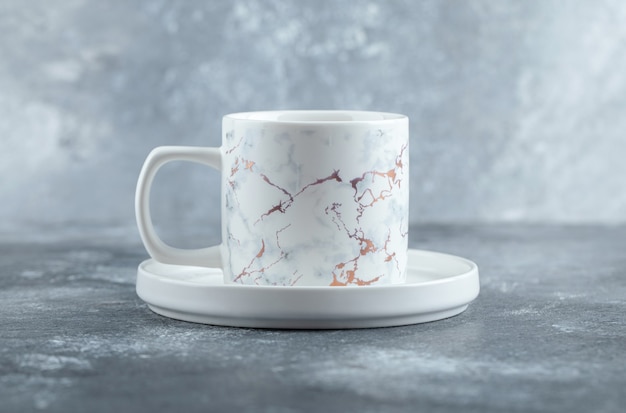 Free photo cup of hot tea on marble table.