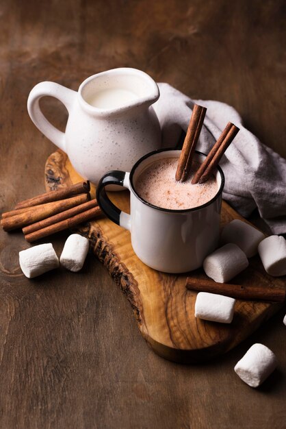 Cup of marshmallow drink with cinnamon