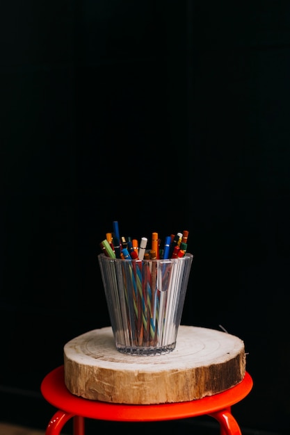 Cup of pencils on stool