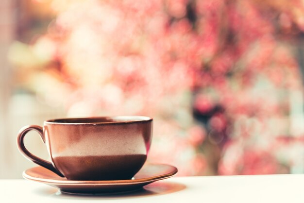 Cup and saucer with bokeh background