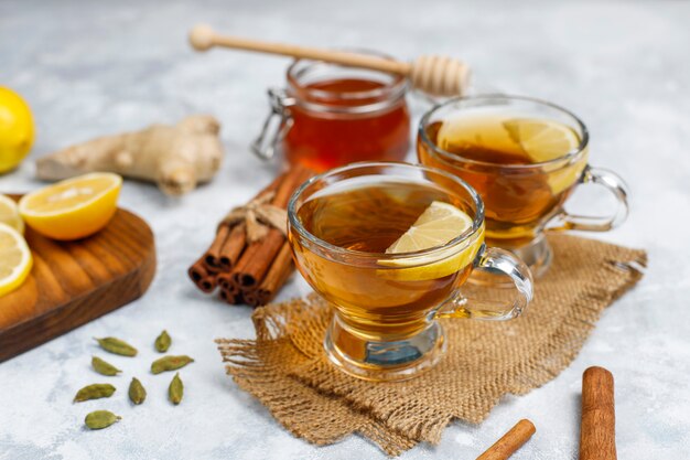 A cup of tea,brown sugar,honey and lemon on concrete  . Top view, copy space